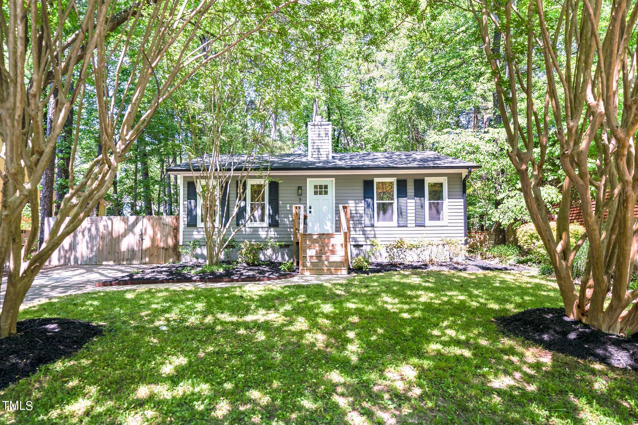 7 Little Spring Lane Durham, NC 27707 - Photo 1 of 25 front view of a house with a yard