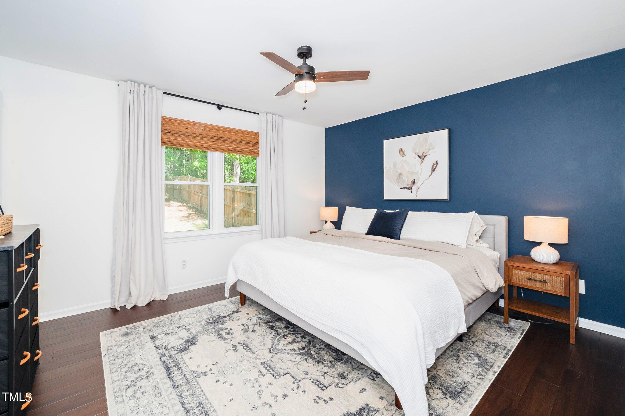 7 Little Spring Lane Durham, NC 27707 - Photo 14 of 25 a bedroom with a large bed and a window