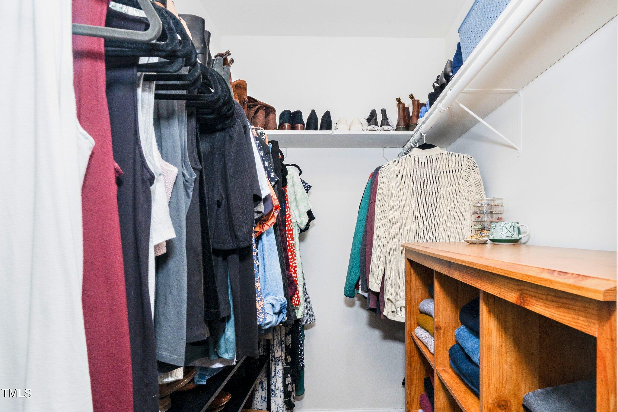 7 Little Spring Lane Durham, NC 27707 - Photo 15 of 25 a view of walk in closet with clothes and shoes