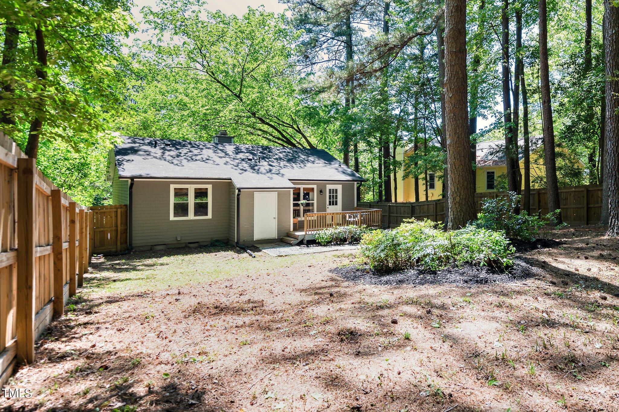 7 Little Spring Lane Durham, NC 27707 - Photo 22 of 25 a view of a house with a yard