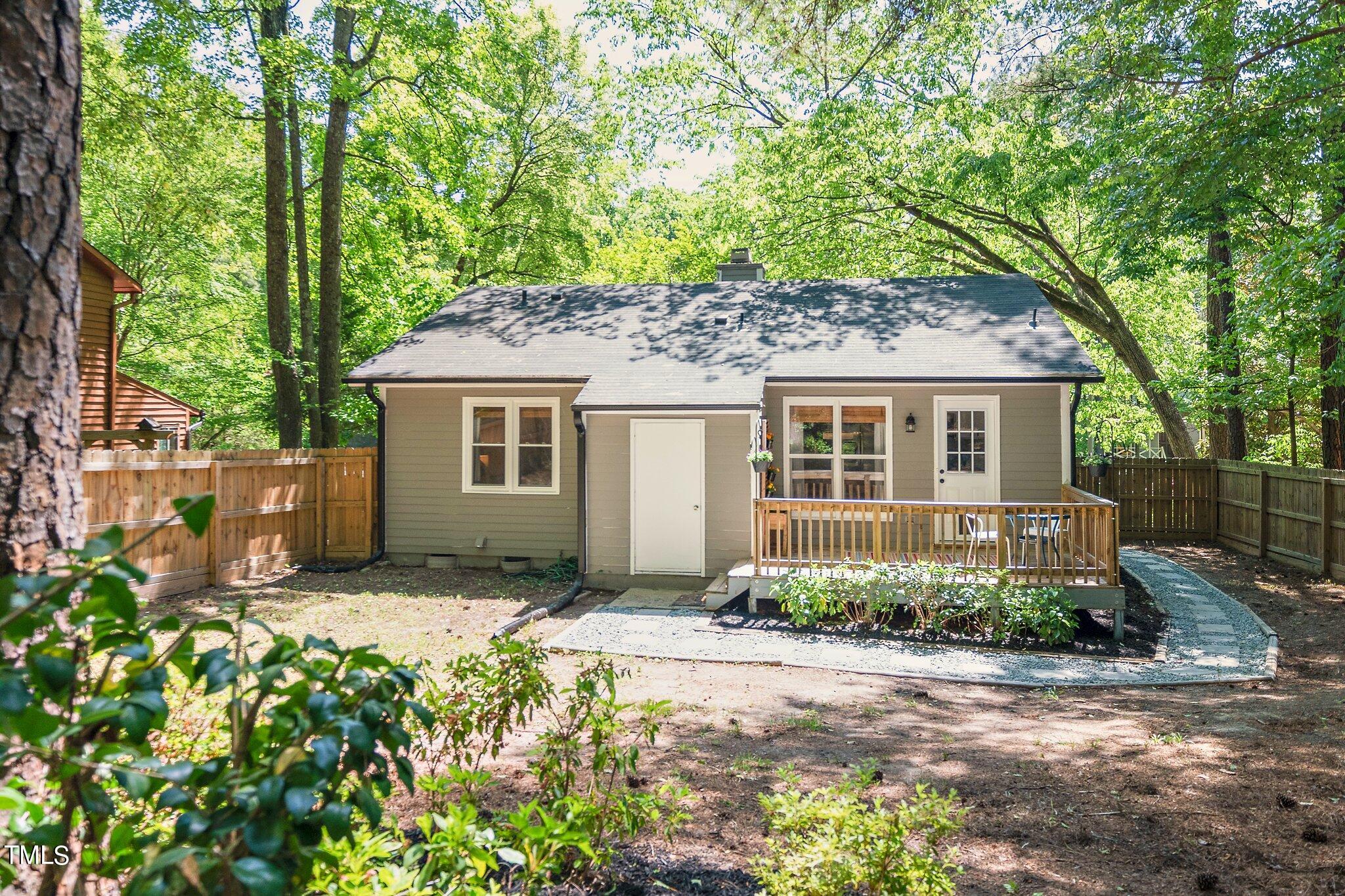 7 Little Spring Lane Durham, NC 27707 - Photo 23 of 25 front view of a house with a patio