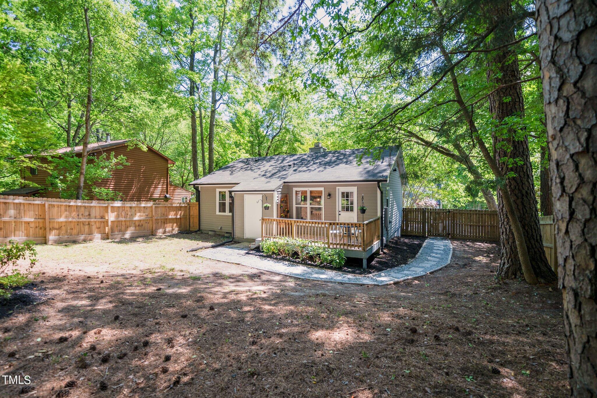 7 Little Spring Lane Durham, NC 27707 - Photo 24 of 25 a view of a house with a yard
