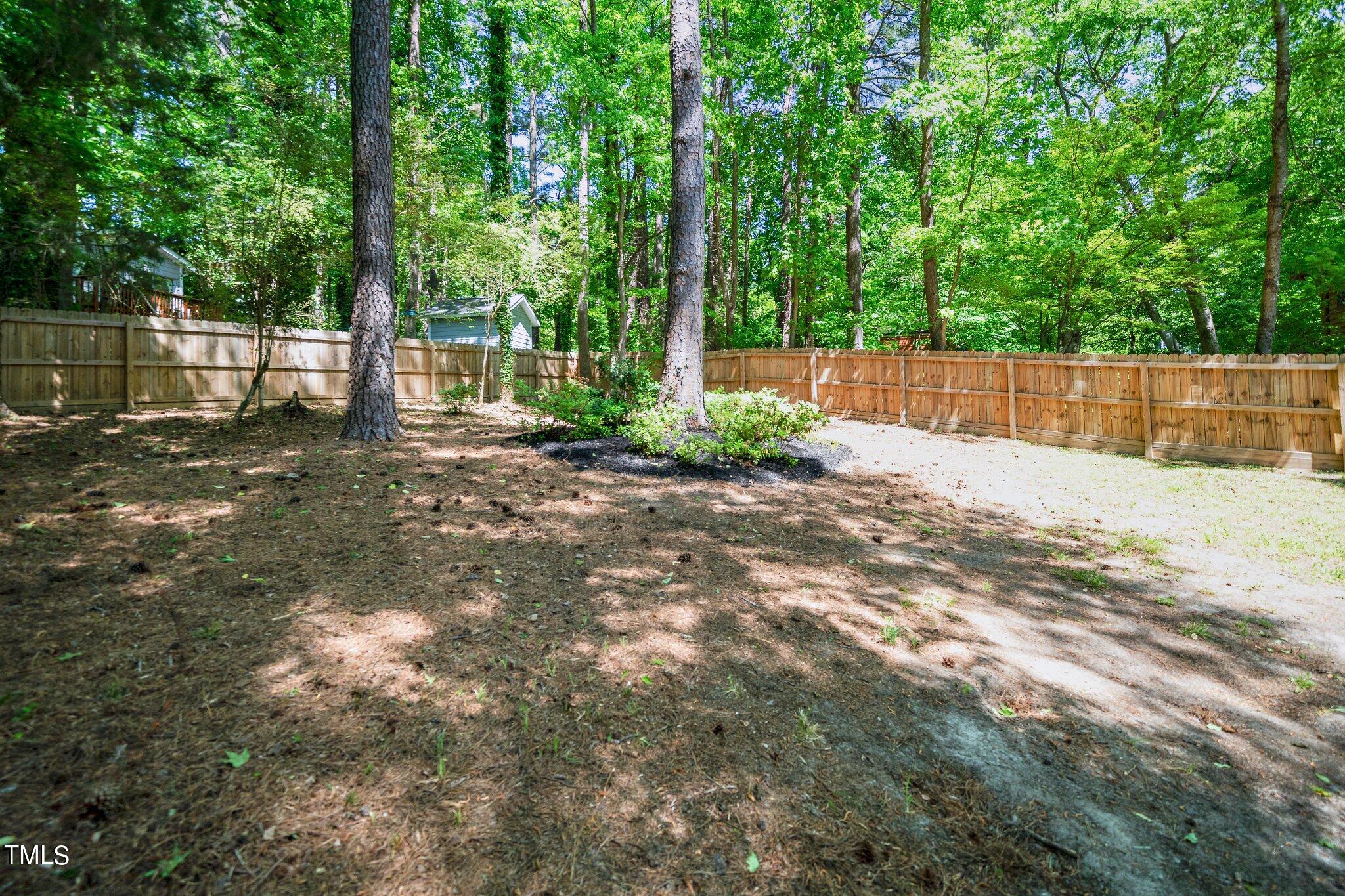 7 Little Spring Lane Durham, NC 27707 - Photo 25 of 25 a view of a backyard with green space