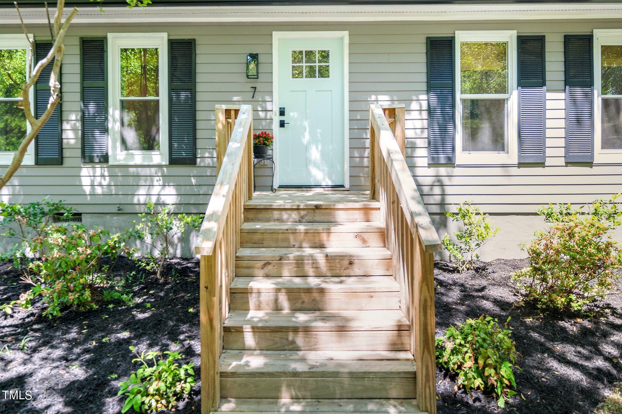 7 Little Spring Lane Durham, NC 27707 - Photo 3 of 25 a front view of a house with a porch
