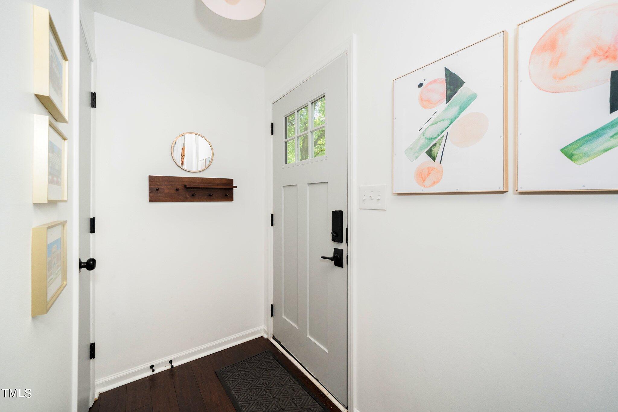 7 Little Spring Lane Durham, NC 27707 - Photo 4 of 25 a bathroom with a sink and a mirror