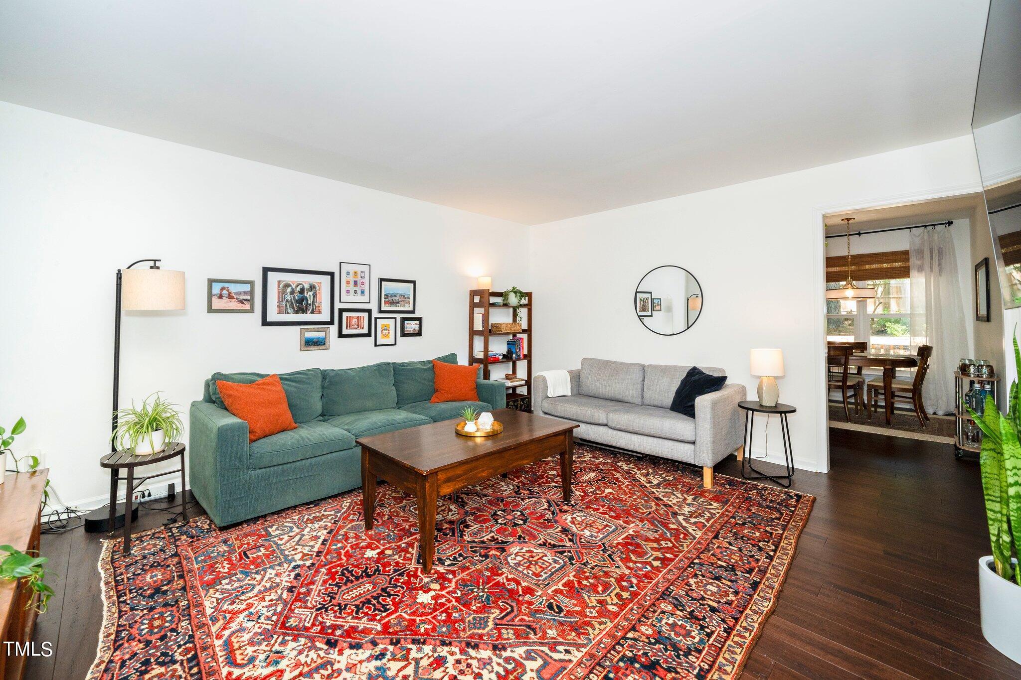 7 Little Spring Lane Durham, NC 27707 - Photo 5 of 25 a living room with furniture and wooden floor