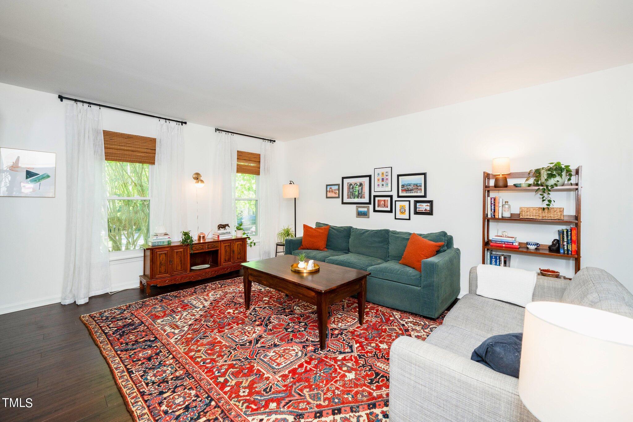 7 Little Spring Lane Durham, NC 27707 - Photo 9 of 25 a living room with furniture and wooden floor