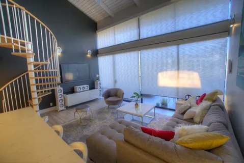 a living room with furniture and a window