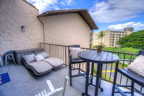 a view of balcony with furniture