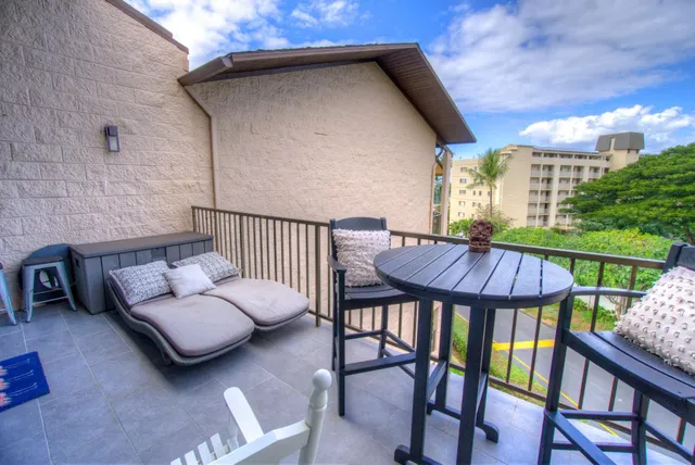 a view of balcony with furniture