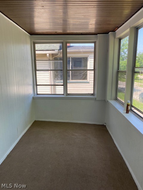802 Wayside Road Cleveland, OH 44110 - Photo 26 of 33 Carpeted spare room with wooden ceiling
