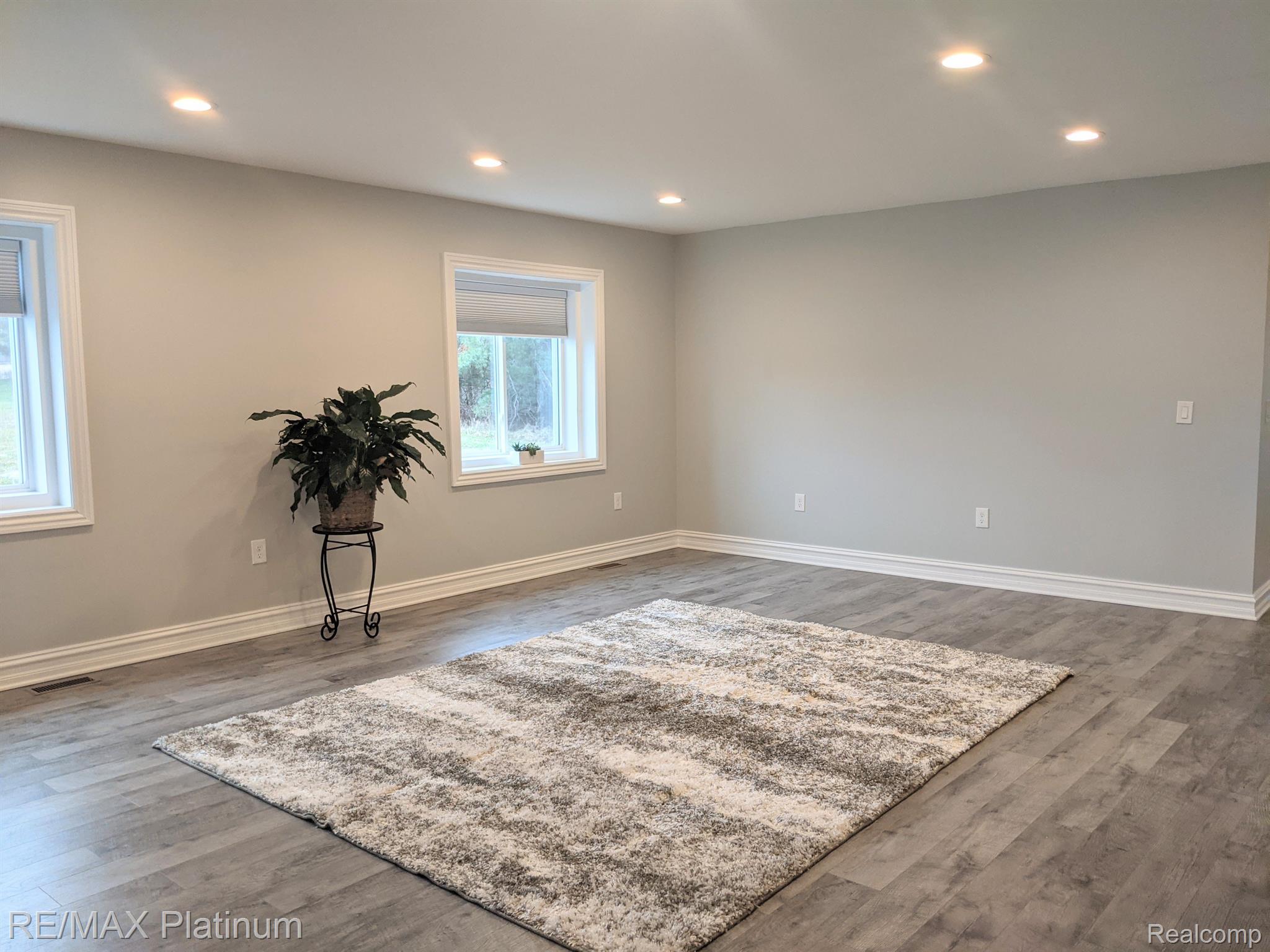 810 Chelsea Ridge Court, Unit 21 Howell, MI 48843 - Photo 3 of 43 Living room shot from dining area