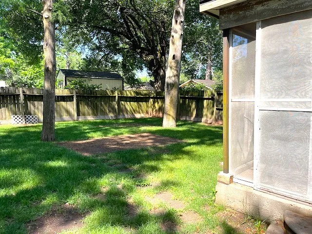 a view of a back yard of the house with a fountain