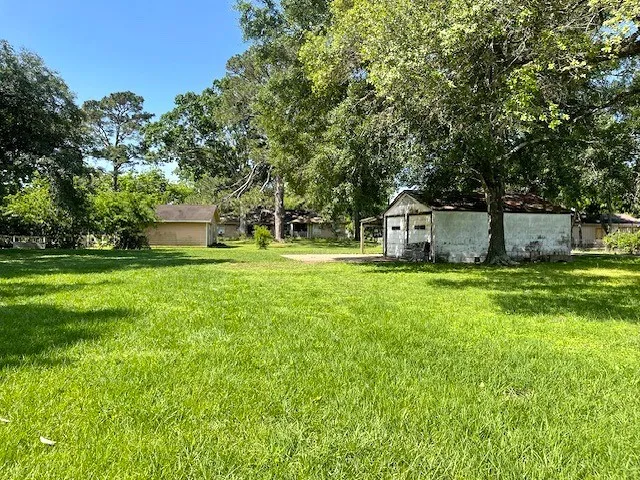 a house view with swimming pool in front of it