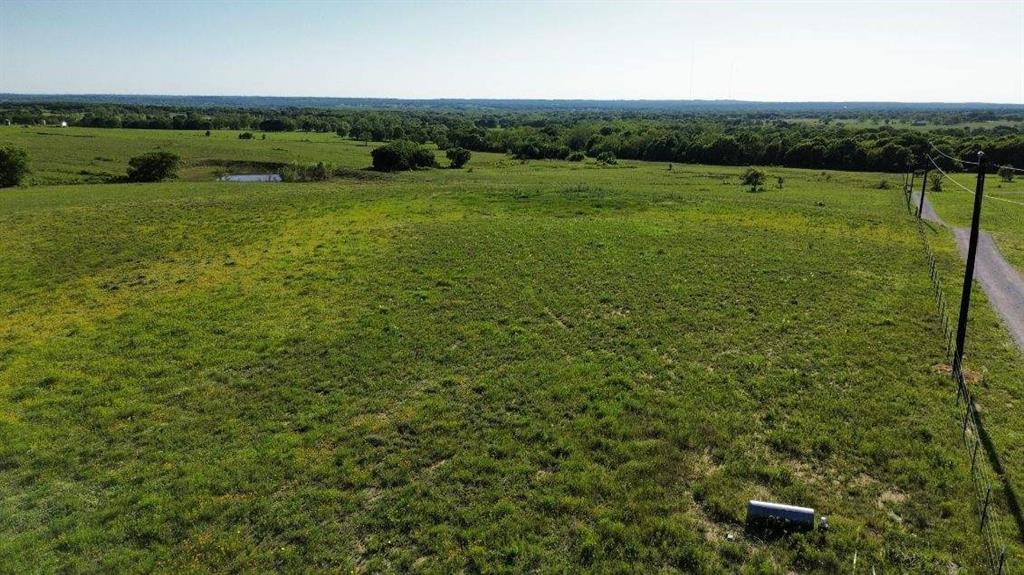 1 County Road 2745 Decatur, TX 76234 - Photo 2 of 11 a view of a green field with lawn chairs