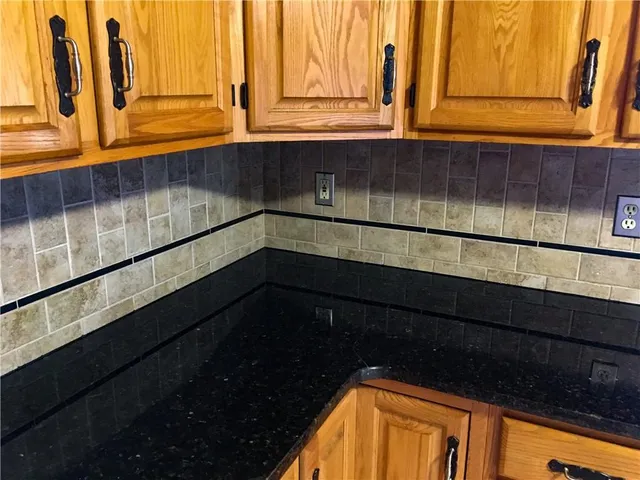 a close view of sink and cabinets