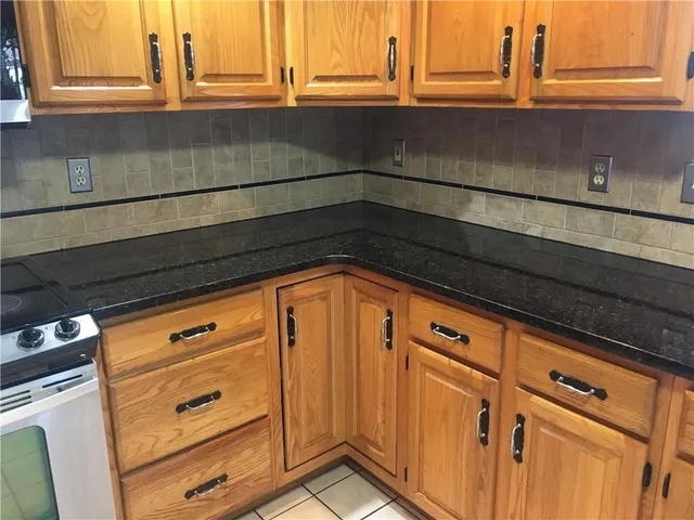 a close view of sink and cabinets