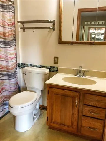 a bathroom with a shower curtain