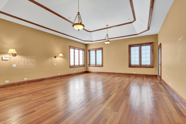 38W340 Henricksen Road St. Charles, IL 60175 - Photo 11 of 54 a view of empty room with wooden floor and fan
