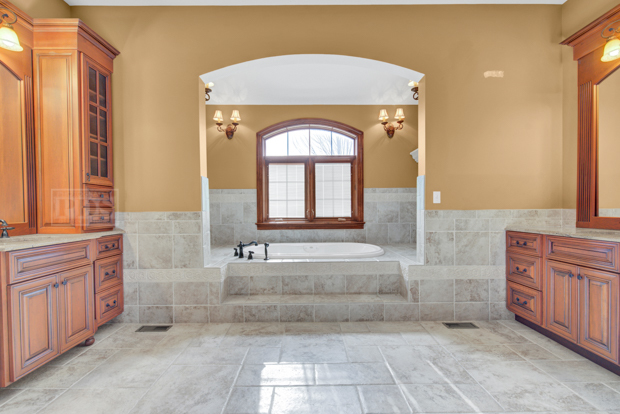 38W340 Henricksen Road St. Charles, IL 60175 - Photo 15 of 54 a bathroom with a tub sink and mirror