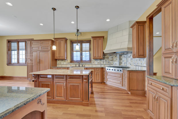 38W340 Henricksen Road St. Charles, IL 60175 - Photo 20 of 54 a kitchen with a sink stove and cabinets