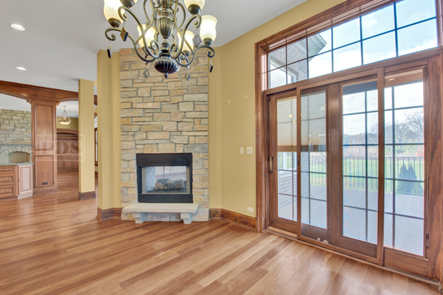 38W340 Henricksen Road St. Charles, IL 60175 - Photo 23 of 54 a view of an empty room with a fireplace and a window