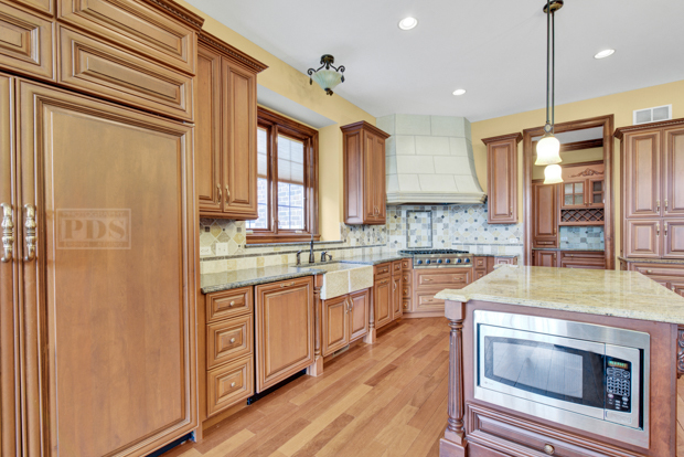 38W340 Henricksen Road St. Charles, IL 60175 - Photo 24 of 54 a kitchen with stainless steel appliances granite countertop a sink a stove and a refrigerator