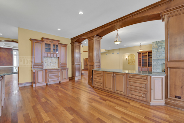 38W340 Henricksen Road St. Charles, IL 60175 - Photo 25 of 54 a open kitchen with stainless steel appliances kitchen island granite countertop a refrigerator and cabinets