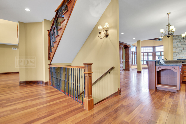 38W340 Henricksen Road St. Charles, IL 60175 - Photo 30 of 54 a view of a hallway with wooden floor and staircase