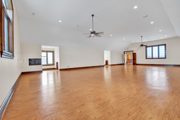 38W340 Henricksen Road St. Charles, IL 60175 - Photo 35 of 54 a view of empty room with wooden floor and fireplace