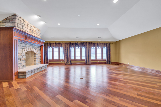 38W340 Henricksen Road St. Charles, IL 60175 - Photo 39 of 54 a view of an empty room with wooden floor and a window