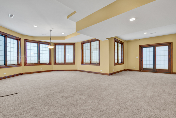 38W340 Henricksen Road St. Charles, IL 60175 - Photo 48 of 54 wooden floor in an empty room with a window