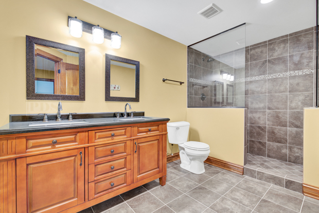 38W340 Henricksen Road St. Charles, IL 60175 - Photo 49 of 54 a bathroom with a toilet sink and mirror