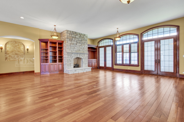 38W340 Henricksen Road St. Charles, IL 60175 - Photo 7 of 54 an empty room with wooden floor and windows