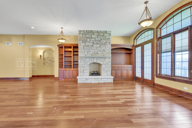 38W340 Henricksen Road St. Charles, IL 60175 - Photo 8 of 54 a view of empty room with wooden floor and fireplace