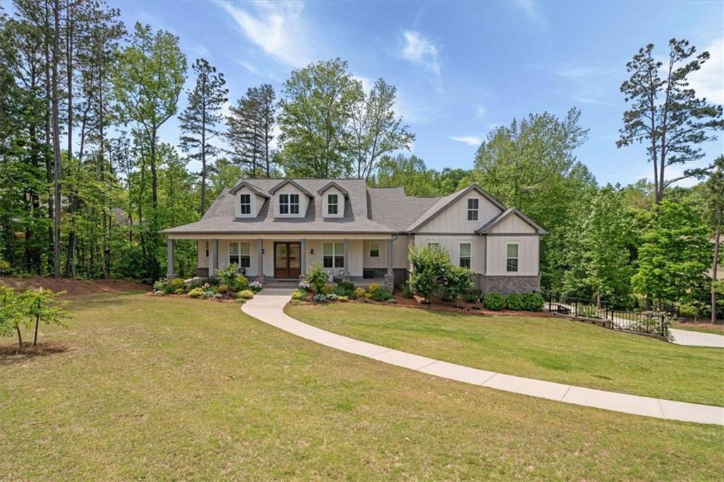 a front view of a house with garden