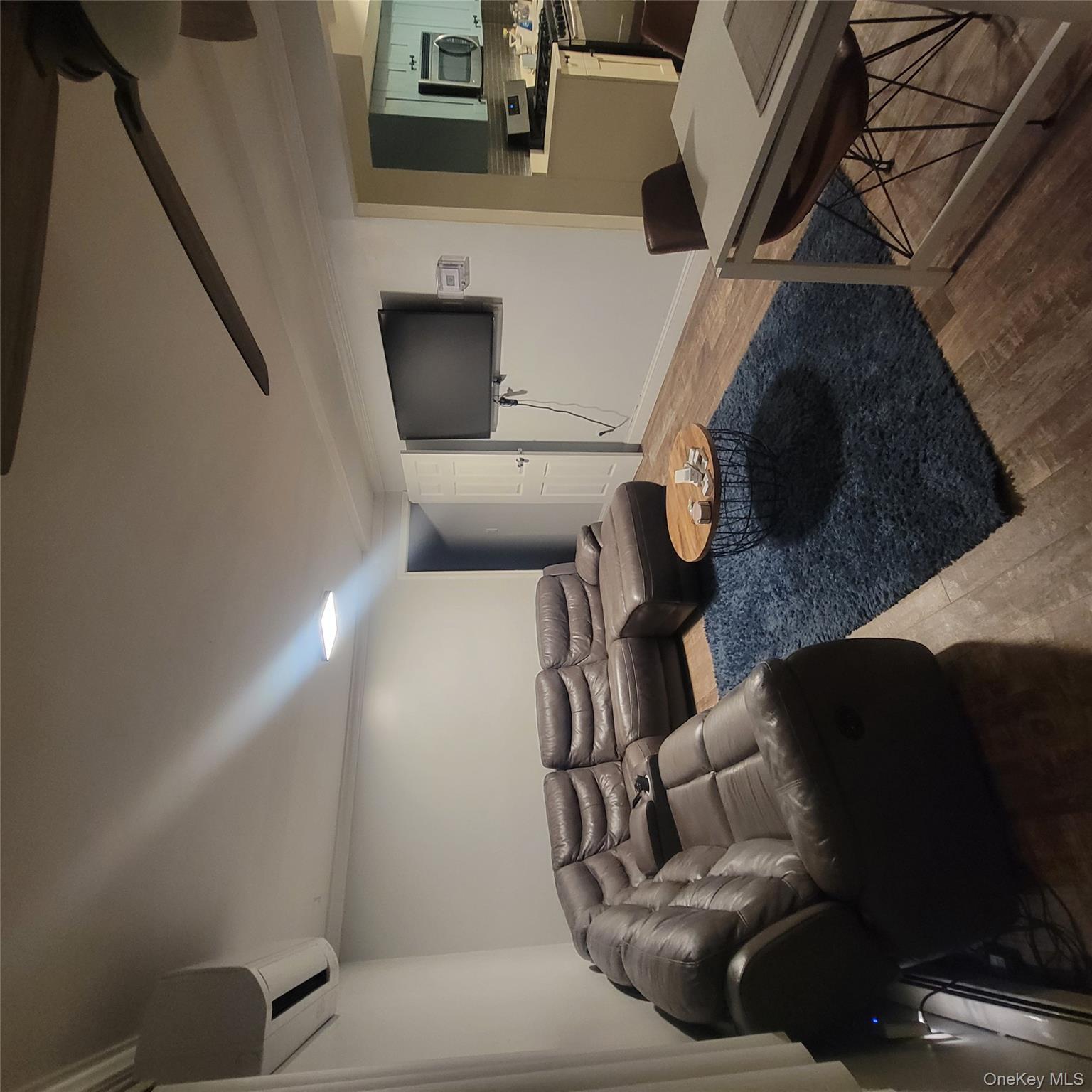 236-14 Bentley Road Queens, NY 11422 - Photo 6 of 7 a living room with furniture and a flat screen tv