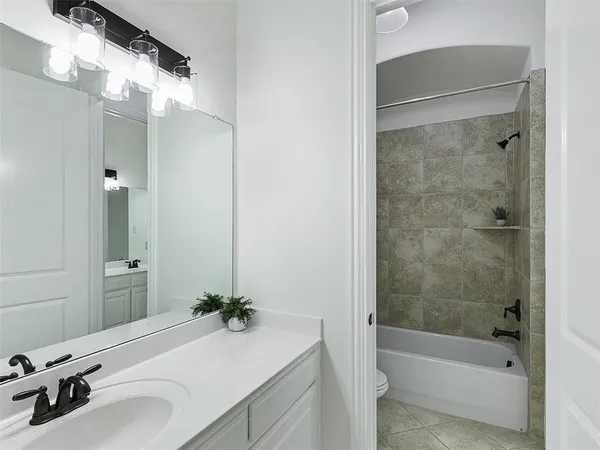 a bathroom with a bathtub and a sink