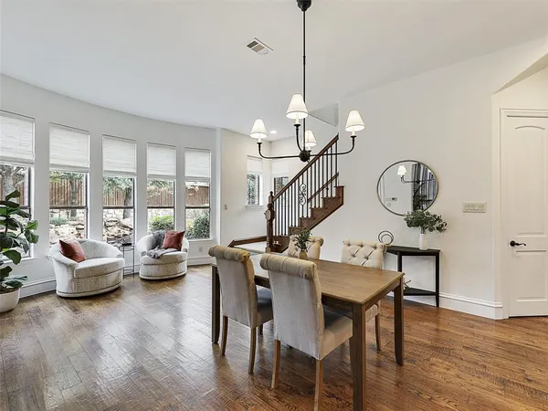 a view of a livingroom with furniture a chandelier