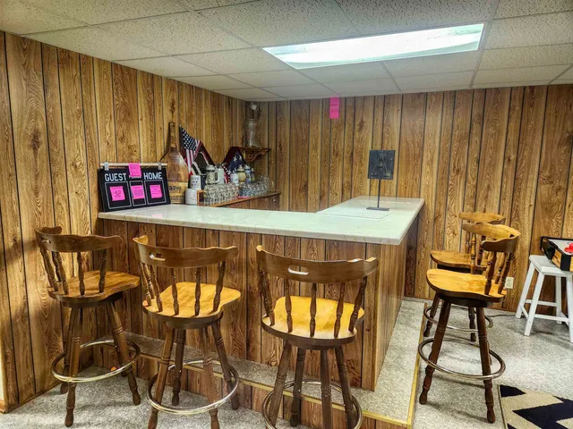 a view of a chairs and table in kitchen