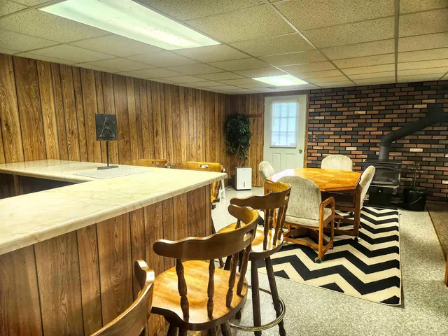 a view of a patio with table and chairs with wooden floor