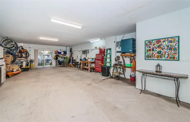 a view of a chairs and table in backyard