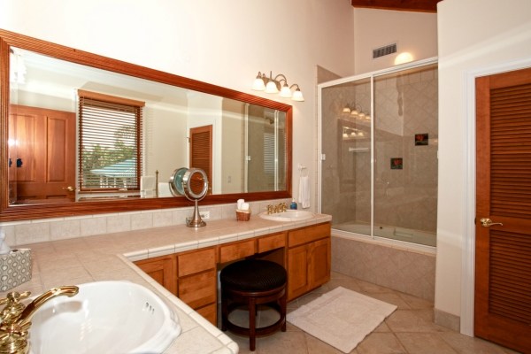 82-5970 Napoopoo Road Captain Cook, HI 96704 - Photo 19 of 24 a bathroom with a tub sink and mirror
