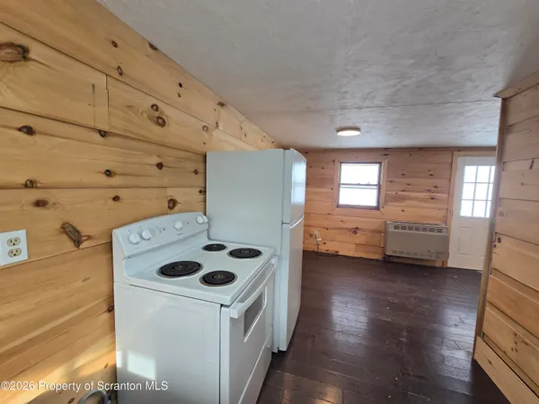 a bathroom with a toilet a sink and bathtub