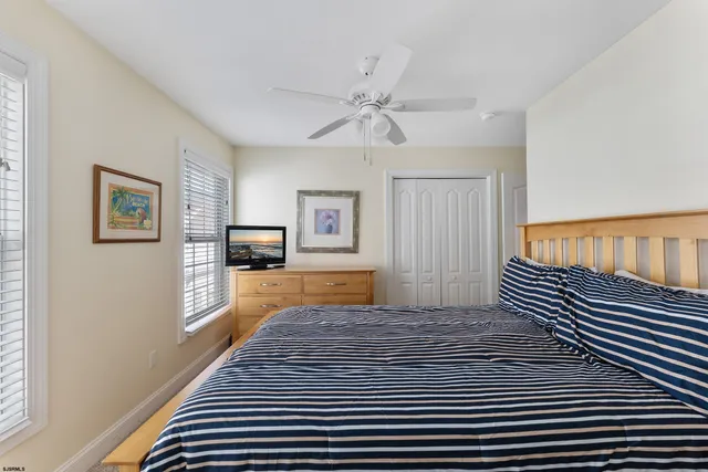 a spacious bathroom with a double vanity sink mirror and toilet