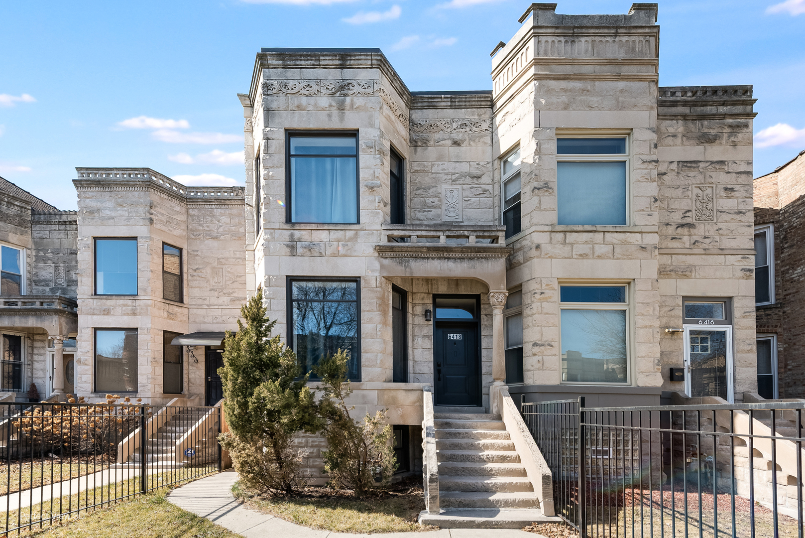 6418 South Greenwood Avenue Chicago, IL 60637 - Photo 1 of 33 a front view of a building with many windows