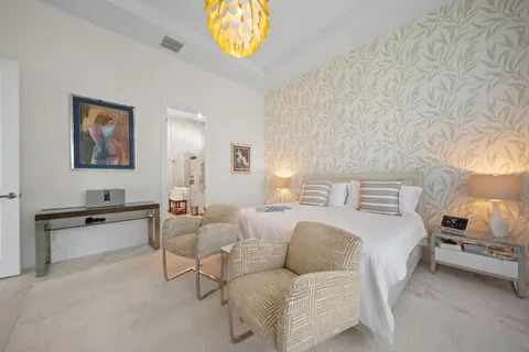 a bedroom with furniture and a window