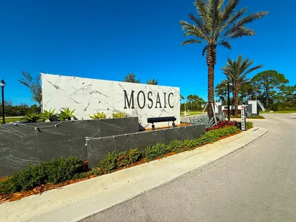 a view of a street with a building and a street sign