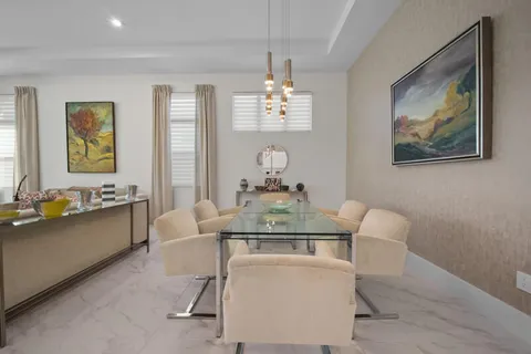 a dining room with furniture and window