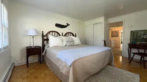 a bedroom with a bed and a table in it